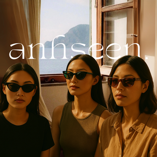Asian women wearing Anhseen inclusive-fit sunglasses in cat-eye and rectangle styles, seated by a sunlit window with an ocean view, evoking summer nostalgia.